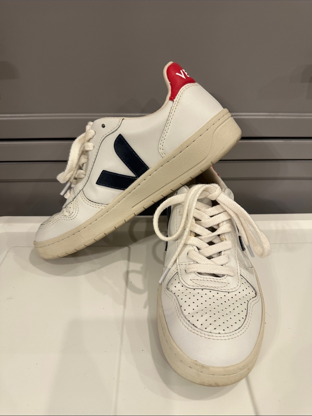 Veja V-10 Leather Sneakers in White with Navy and Red Accents